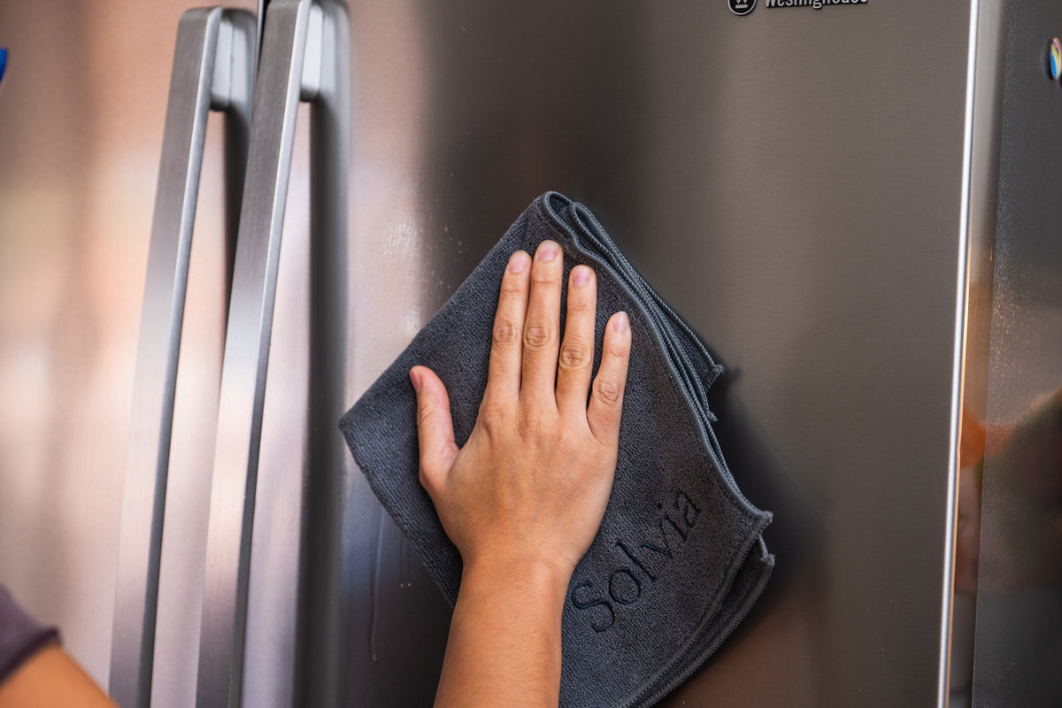 Kitchen surface being wiped with a Solvia reusable cloth